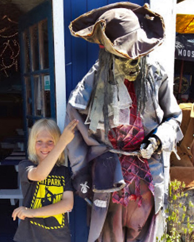 Outside Kid Holding Hand of Skeleton