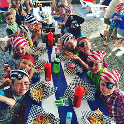 kids at the table with pirate hats