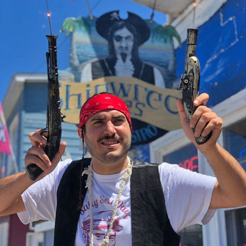 Pirate Holding Up Two Old Pistols